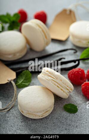 Vanilla macarons on a gray surface Stock Photo