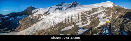 Low angle shot of a snowy mountainous scenery under the clear sky in Grossvenediger, Austria. Stock Photo