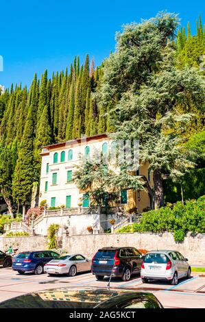 Toscolano Maderno, Lombardy, Italy - September 12, 2019: Beautiful Italian medieval architecture on the coast of lake Garda. Classic building facade s Stock Photo