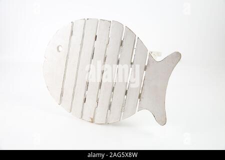 White fish-shaped outdoor wooden table isolated on a white background Stock Photo