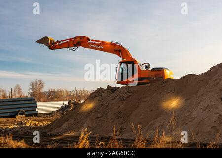 excavator laying earthworks pipeline digger trench