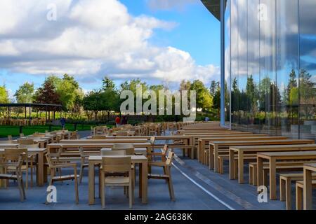 Cupertino CA USA December 14, 2019: Apple headquarters offices building exterior with outdoor eating area, on a bright cold December day. Stock Photo