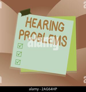 Handwriting text writing Hearing Problems. Conceptual photo partial or total inability to hear Hearing impairment Paper stuck binder clip colorful bac Stock Photo