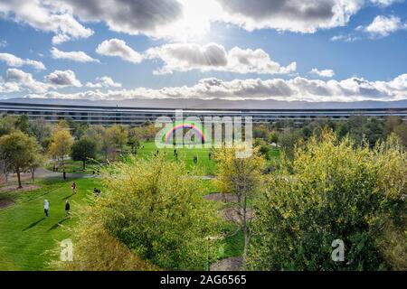 Cupertino CA USA December 14, 2019: Apple headquarters offices building exterior with rainbow in inner court, on a bright cold December day. Stock Photo