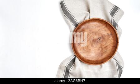 Tablecloth, wooden plate on blue table background Stock Photo