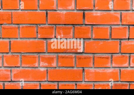 Texture or background wall of a classic red brick with scratches and cracks Stock Photo