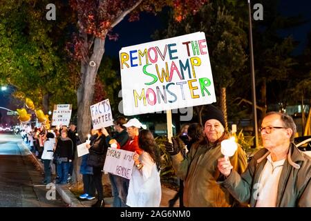 Dec 17, 2019 Mountain View / CA / USA - Remove the swamp monster sign raised at the Impeachment Eve Vigil rally held in one of the cities of San Franc Stock Photo