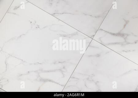 Ceramic tile background with marble texture. Diagonal layout of tiles. Stock Photo