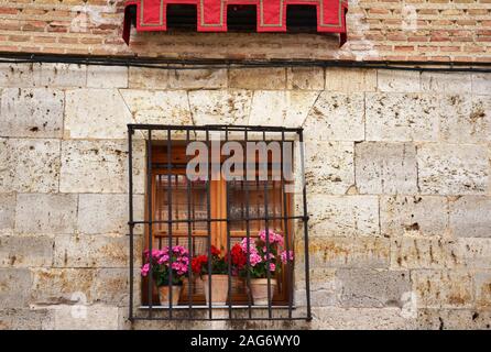 window decorated with pink flowers Stock Photo