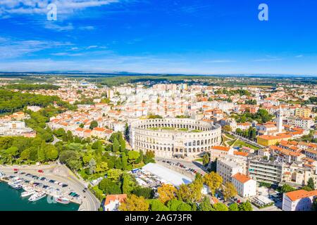 Ancient Roman arena, historic amphitheater and old town center from drone, aerial view, city of Pula, Adriatic sea, Croatia Stock Photo
