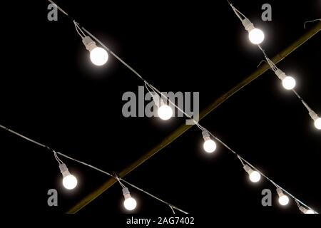 LED Lamp String on Black Night Scene Background. LED light on black background Stock Photo