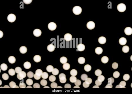 White Blurred Lights of Lamp on Black Background Stock Photo