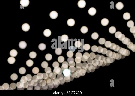 White Blurred Lights on Black Background. Stock Photo