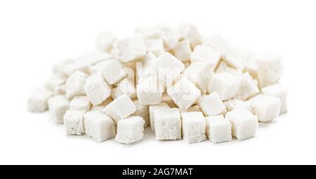 Coconut dices isolated on white background (selective focus; close-up shot) Stock Photo