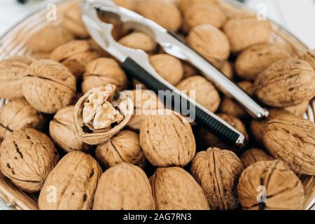 Nutcracker and walnuts in a large bowl Stock Photo