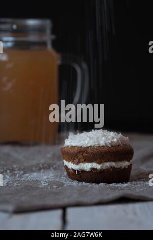 Selective focus shot of a delicious buttercream coconut cupcake Stock Photo