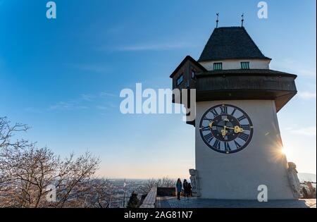 View at clock tower in Graz on a blue sky in winter Stock Photo