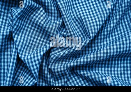 texture of checkered fabric pattern background toned classic blue color Stock Photo