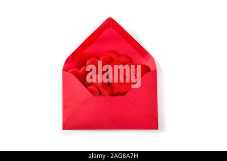 Red paper envelope with hearts inside isolated on white background. Valentine's Day concept. Stock Photo
