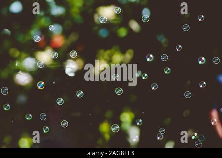 Closeup shot of bubbles in the air with a blurred background Stock Photo