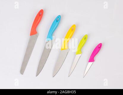 A group of colorful kitchen knifes isolated on white background Stock Photo