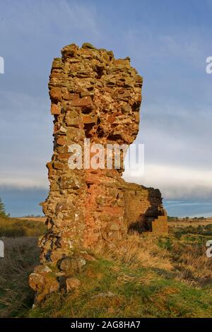 The end on view of the East Curtain wall of the Red Castle at Lunan Bay with its stone structure in imminent danger of collapse. Stock Photo