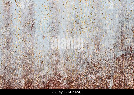Texture of peeling paint from rusty metal. Abstract background for design. Stock Photo