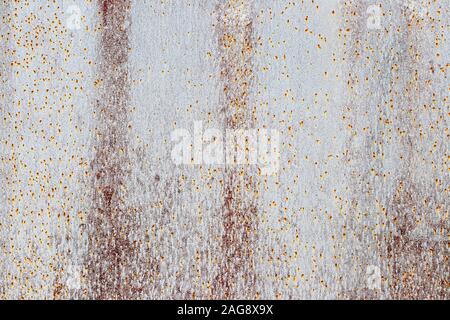Texture of peeling paint from rusty metal. Abstract background for design. Stock Photo