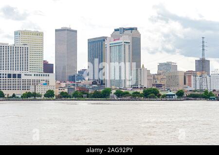New Orleans, LA/USA – June 14, 2019: Skyline of commercial business district and shops along Mississippi River walk. Stock Photo