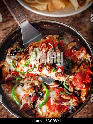 Overhead view of deep dish supreme pizza Stock Photo