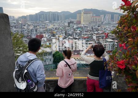 (191218) -- MACAO, Dec. 18, 2019 (Xinhua) -- Tourists visit the Mount Fortress (Fortaleza do Monte) in Macao, south China, Dec. 17, 2019. Over the past two decades, the special administrative region has made great strides in economic development and achieved prosperity and stability under the 'one country, two systems' principle. (Xinhua/Wang Shen) Stock Photo