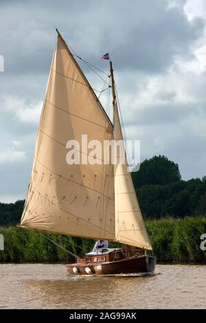 Norfolk Broads. England. 09.13.08. A classic wooden yacht sailing on the River Bure near Upton Marshes in the Norfolk Broads in southeast England. Stock Photo