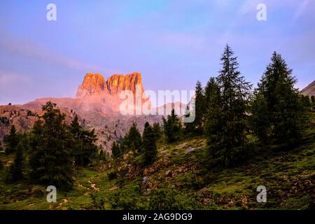 The summit of Monte Averau, glowing red at sunset, seen from Falzarego Pass, Passo di Falzarego Stock Photo