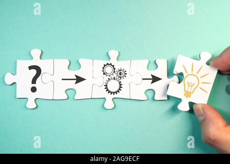 finding solution for a problem, analysis concept with top view of jigsaw puzzle pieces Stock Photo