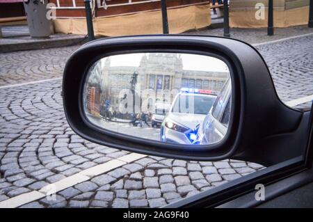 A police control at Wenceslas Square in Prague, Czech Republic, on Tuesday, December 17, 2019, viewed in rear-view mirror (rearview mirror). (CTK Phot Stock Photo