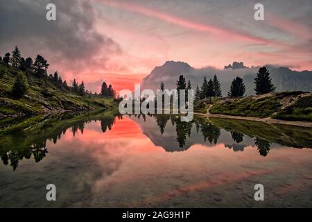 View across the Lake Limedes, Lago di Limides, the summit of Lagazuoi in the distance, at sunset Stock Photo