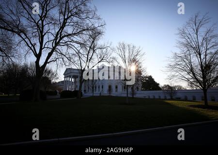 The sun rises behind the North Portico of the White House on December 18, 2019 in Washington, DC., Later today the U.S. House of Representatives will vote on two articles of Impeachment against U.S. President Donald Trump charging him with abuse of power and obstruction of Congress. (Photo by Oliver Contreras/SIPA USA) Stock Photo