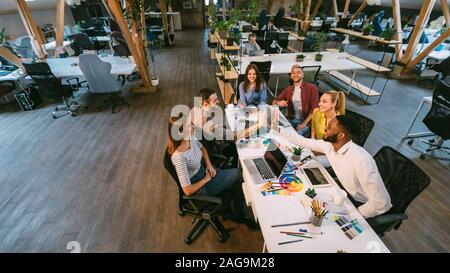 Coworking space. Young team working in office Stock Photo