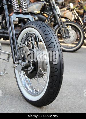 Classic White Wall Tire On The Front Wheel Of Custom Motorcycle Stock Photo