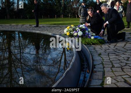 18 December 2019, Berlin: Romani Rose (l-r), Chairman of the Central Council of the German Sinti and Roma, and Jeremy Issacharoff, Ambassador of the State of Israel, lay wreaths of flowers at the monument to the Sinti and Roma murdered in National Socialism. Photo: Gregor Fischer/dpa Stock Photo
