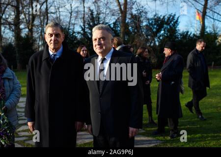 18 December 2019, Berlin: Romani Rose (l), Chairman of the Central Council of the German Sinti and Roma, and Jeremy Issacharoff, Ambassador of the State of Israel, come to a wreath-laying ceremony at the Memorial to the Sinti and Roma of Europe murdered under National Socialism. Photo: Gregor Fischer/dpa Stock Photo