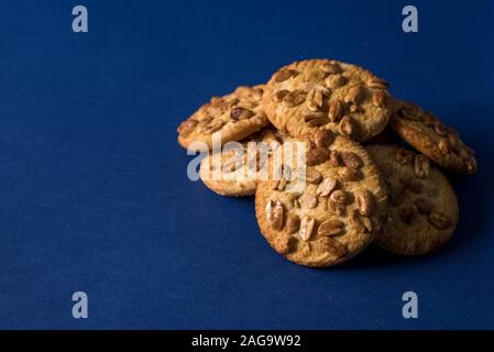 homemade healthy cookies with roasted peanuts on a blue background with place for your text Stock Photo