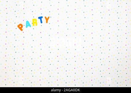 The word party printed on a various colored stars background, colorful party concept Stock Photo