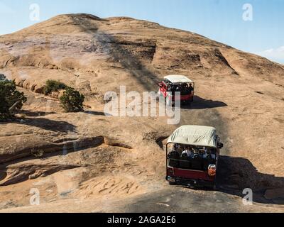 A 4x4 Hummer tour on the Hell's Revenge Trail in the Sandflats Recreation Area near Moab, Utah. Stock Photo