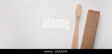 Holder with eco bamboo toothbrush on white background Stock Photo