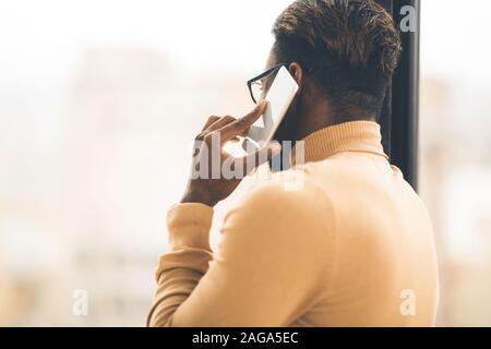 Unrecognizable black man talking on the phone Stock Photo