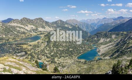 Panoramic shot of the turquoise lakes of Lac d’Aumar, Lac d’Aubert and Les Laquettes in the Néouvielle Massif natural reserve in the French Pyrenees Stock Photo