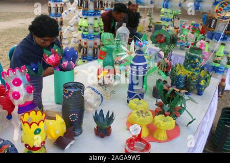 Several objects made out of empty plastic bottles collected by the BD Clean members are displayed at the exhibition.BD Clean members collected 3 million empty plastic bottles from various parts of Bangladesh as a homage to the three million martyrs who sacrificed their lives in the Liberation War of 1971. Artistes crafted various objects, including a mural of Bangabandhu, boats and the map of Bangladesh, using the scraps. The works were put on display at Mohakhali's T&T Colony playground in Dhaka on the eve of Victory Day. Stock Photo