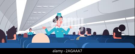 stewardess explaining instructions for passengers female flight attendants in uniform showing emergency exits safety demonstration concept airplane board interior horizontal vector illustration Stock Vector