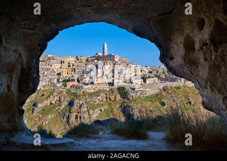 Matera view across 'la Gravina' ravine to the Sassi of Matera from inside a Sassi cave, Basilicata, Italy. A UNESCO World Heritage site. Stock Photo